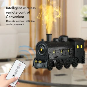 WHIMSICAL TRAIN, ESSENTIAL OIL DIFFUSER,  AND MIST HUMIDIFIER.LED LIGHTS ILLUMINATE THE MIST COMING FROM THE SMOKESTACK.